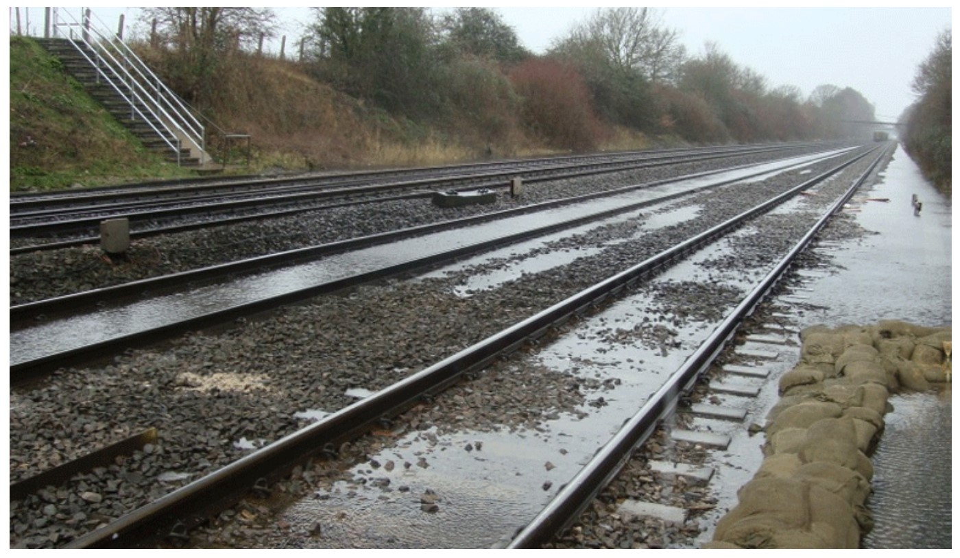 A picture of  flooding on some railway tracks 