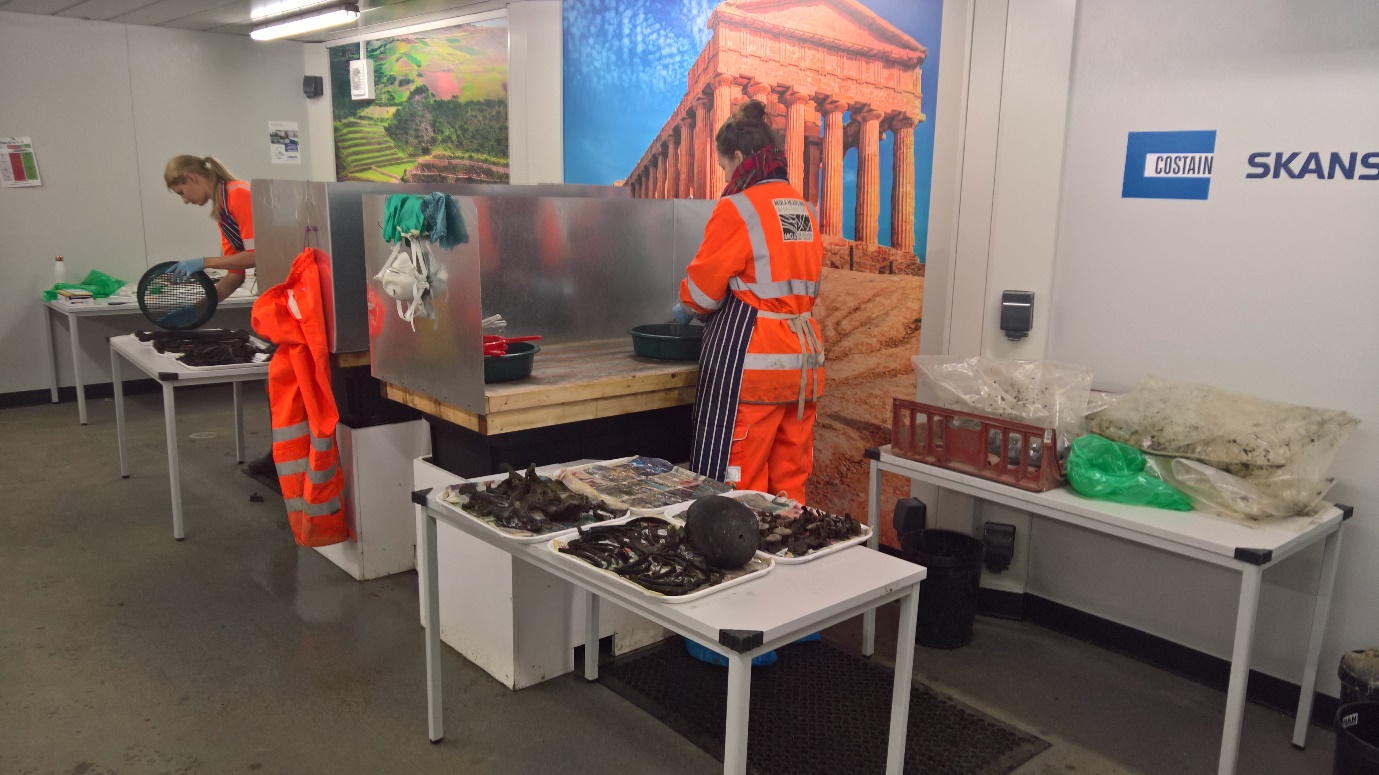 Picture of two workers in an archaeological lab supporting post excavation activities