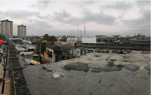 A picture of a floor-by-floor demolition of a building 

