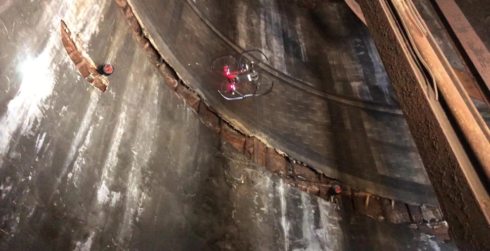 A picture of a drone flying through a shaft during an inspection