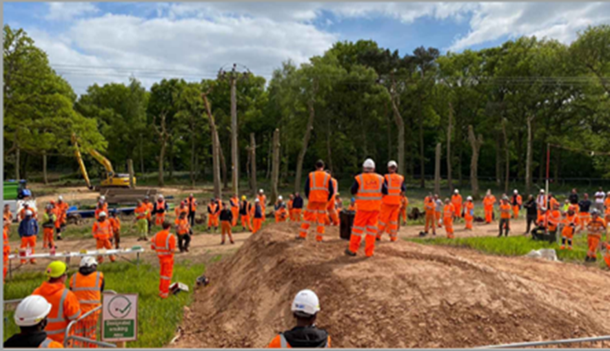 A group of staff in PPE having a briefing at Broadwalls Wood in Warwickshire 
