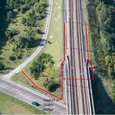 overhead picture of rail tracks with outlined area in red showing maintenance access