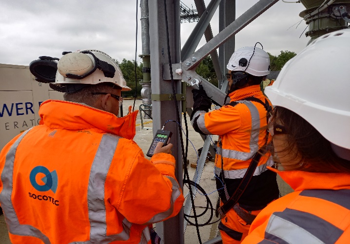 A picture  of 3 workers carrying out Tests  
