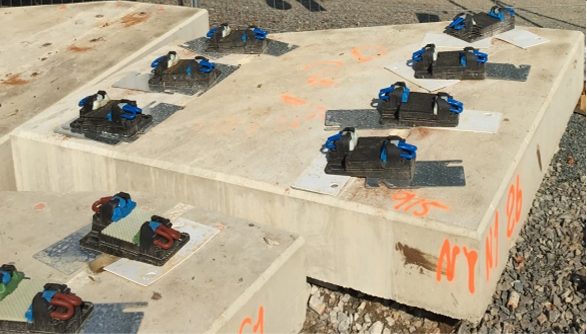 A group of concrete blocks with blue straps