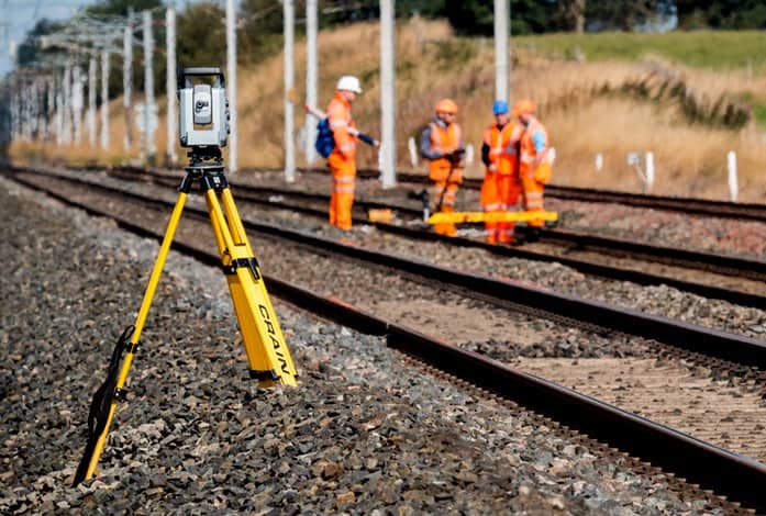 Picture of traditional ground-based survey technique on  a railway tack