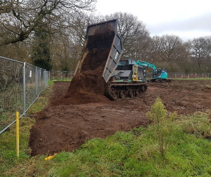 Picture of dumper truck loose tipping at a receptor site